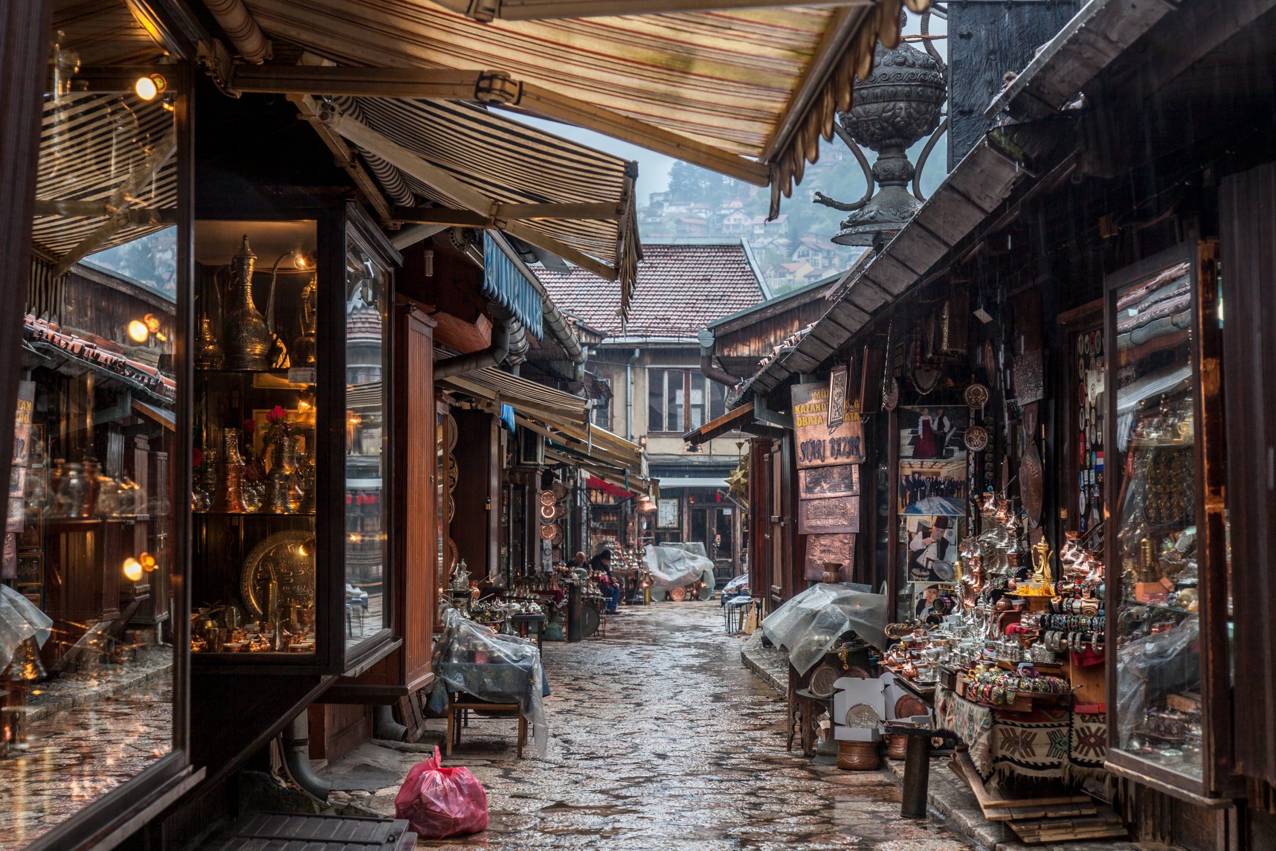 Copperware shops lining a narrow cobbled lane in Sarajevo’s Baščaršija bazaar
